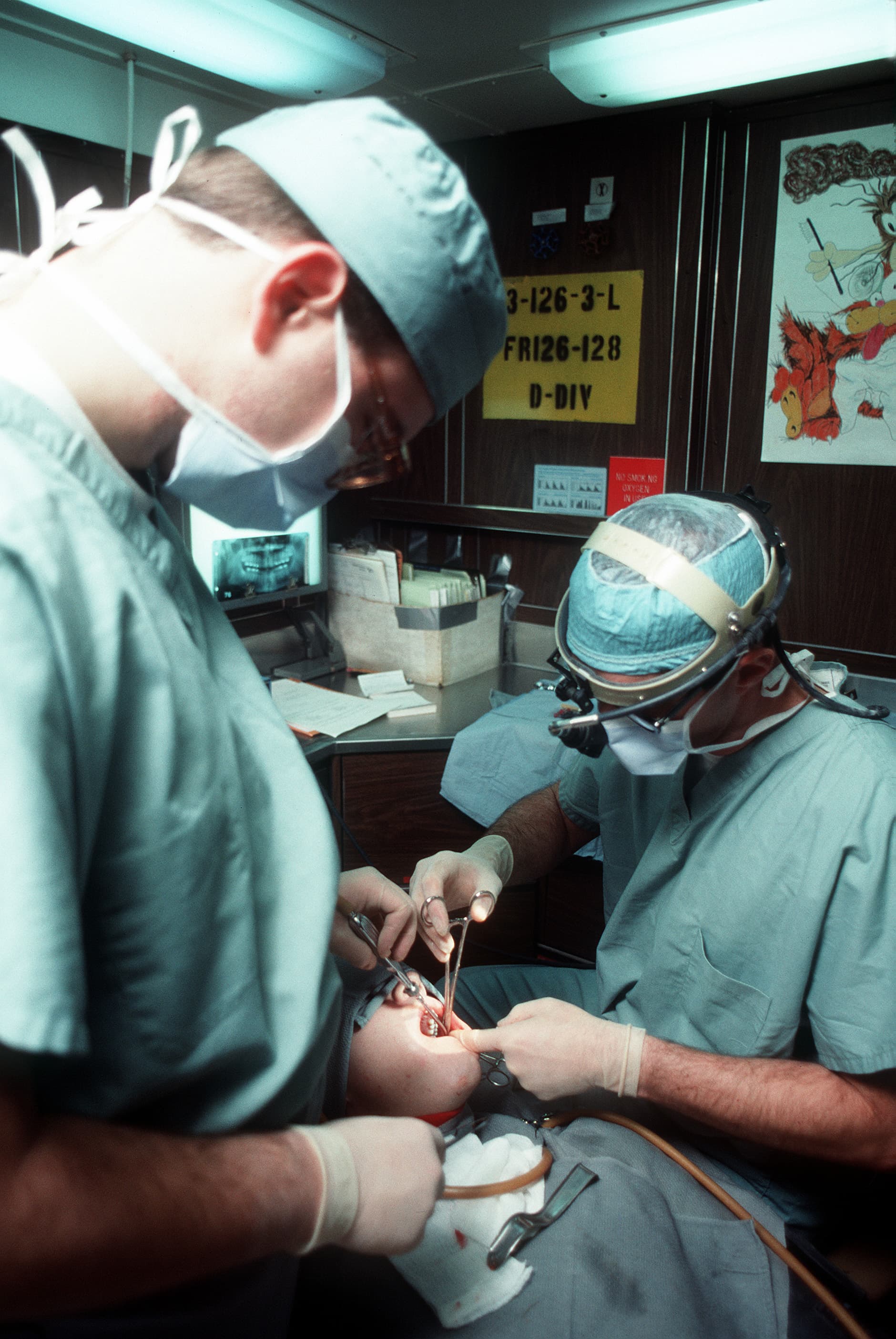 Dental clinic treatment room with chair and equipment